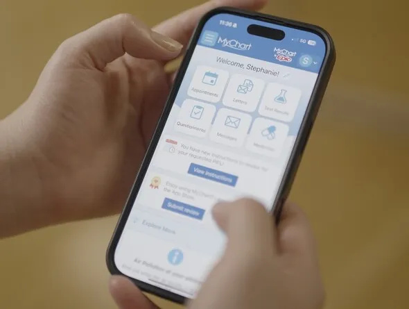 Close-up of someone's hands using the MyChart app on their smartphone