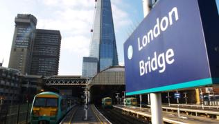 London Bridge station with trains in the platforms and the Shard in the background.