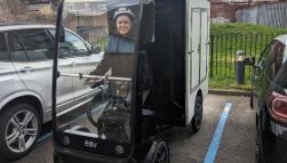 An image of a clinical nures practitioner with the e-cargo bike