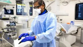 Professor Pallav Shah, Consultant Respiratory Physician at Royal Brompton Hospital, conducting a procedure on a patient using the Ion endoluminal system (Ion)