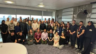About 40 members of staff in a conference room