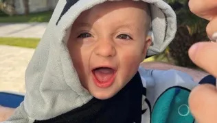 Lennie looking at the camera smiling