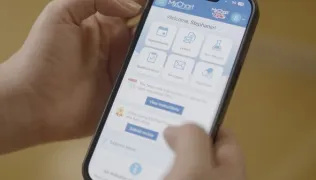 Close-up of someone's hands using the MyChart app on their smartphone
