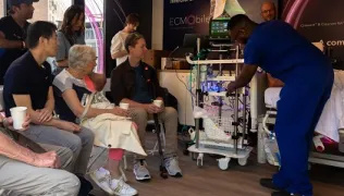 Member of staff demonstrating ECMO device