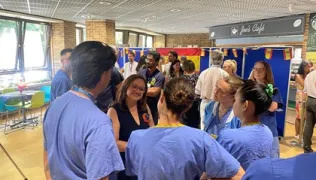 Ms Emma Aparici talking with staff at Royal Brompton Hospital