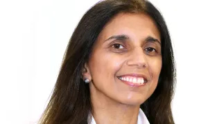 A portrait shot of the Trust's Chief Nurse, Avey Bhatia. She is smiling and wearing a white shirt and navy jacket.
