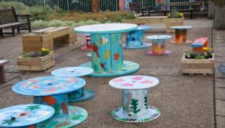 Our pop up garden, created with decoratively painted cable reels