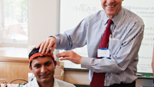Professor Harvey Dillon demonstrates HEARLab equipment