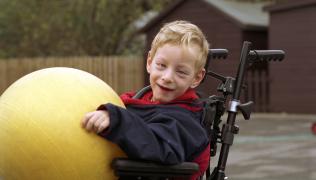 boy in wheelchair with ball