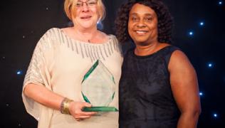 Cathy Ingram, head of service for the adult community directorate receives the Inspiring Leadership Award from Baroness Lawrence.