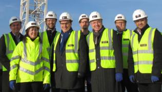 Simon Hughes MP (4th left) on the new Cancer Centre construction site with staff from the Trust project team and building contractors Laing O’Rourke