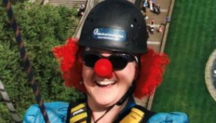 Alison Cooper wearing clown nose during St Thomas' abseil