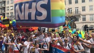 Guy's and St Thomas' staff at London Pride with NHS rainbow blimp