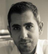 A black and white photo of Kariem el Boghdadly, he has short hair