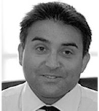 A black and white image of Simon Chowdhury. He has short hair