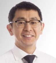 Roger Wong is an man with short black hair and glasses