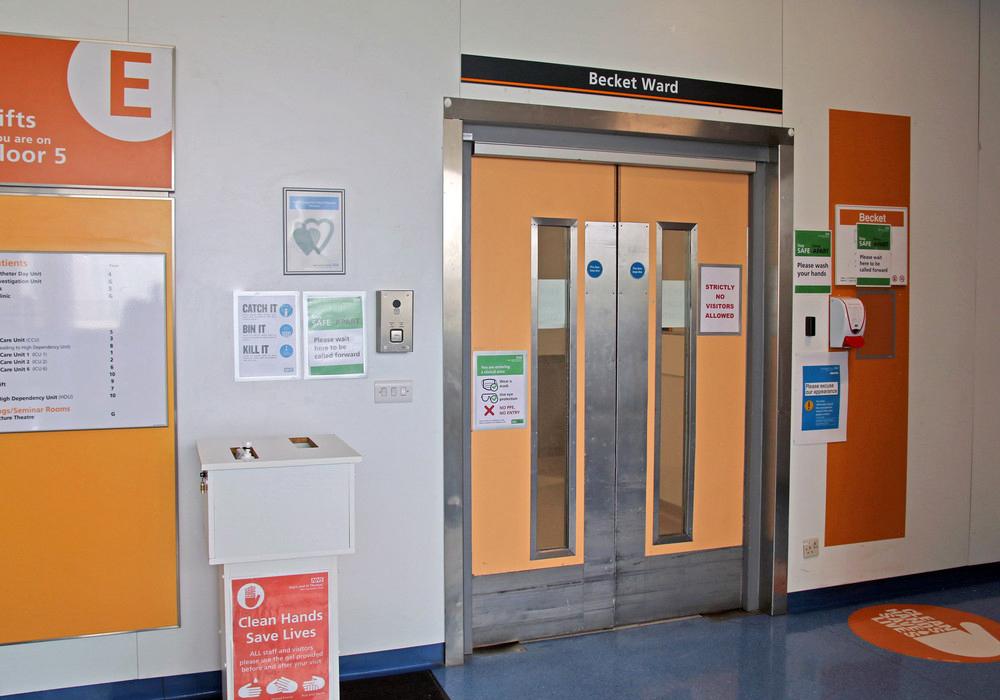Orange double entrance doors to Becket ward