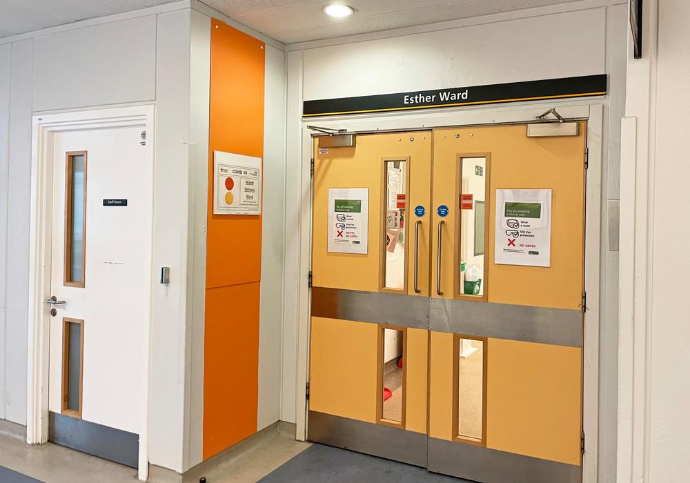 Orange entrance doors to Esther ward