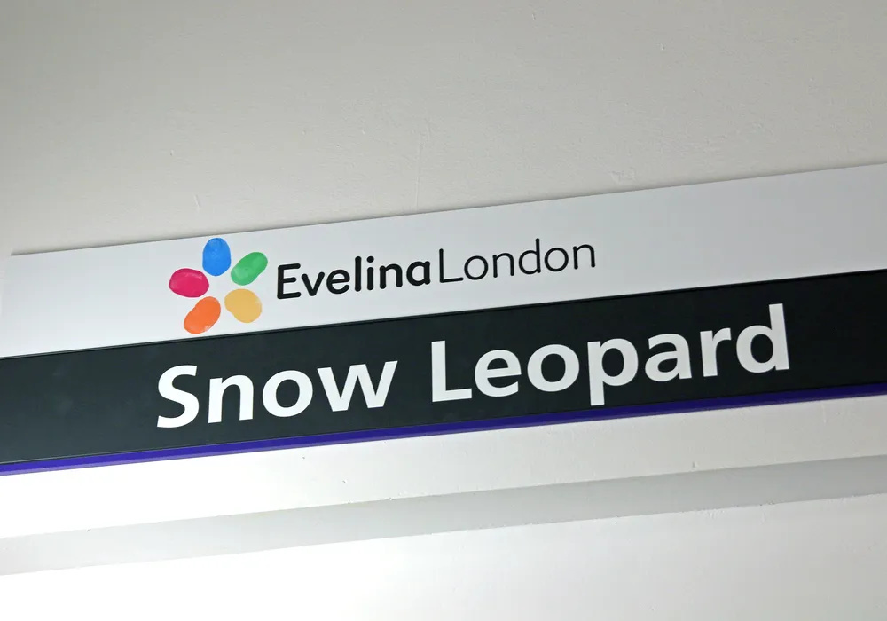 A sign with the Evelina London logo and the words Snow Leopard