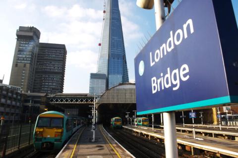 London Bridge station with trains in the platforms and the Shard in the background.