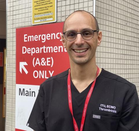 Dr Andrew Retter outside the emergency department sign at St Thomas' hospital. 