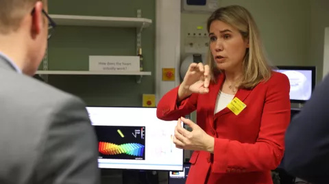 CMR unit team member demonstrating how the new scanner works