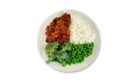 A plate with one quarter full of broccoli and peas, one quarter full of chilli and one quarter full of rice