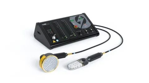 A black machine with with 2 wires. Each wire is connected to a different probe. One is shaped like a shower head and the other is like a lollipop.