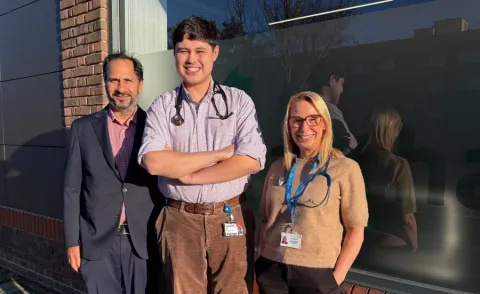 Some of the team running the community heart valve clinics are standing next to each other outside a GP surgery in Stockwell