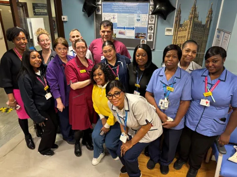 Members of the discharge unit and staff from the task group