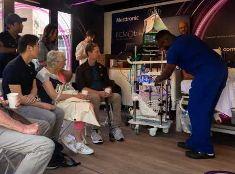 Patients watching demonstration of ECMO device