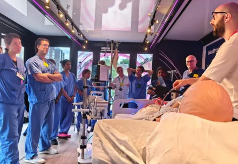Staff being given demonstration of ECMO device