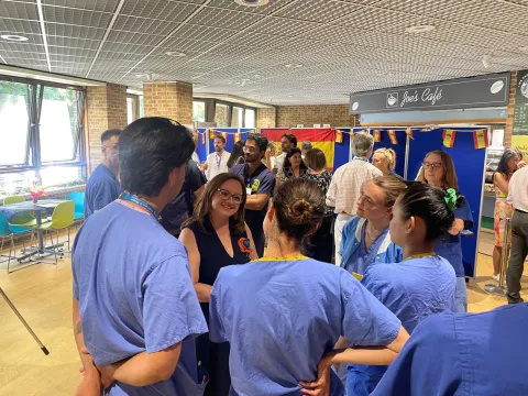 Ms Emma Aparici talking with staff at Royal Brompton Hospital