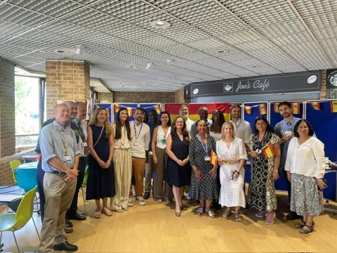 Ms Emma Aparici and members of staff posing for a photograph