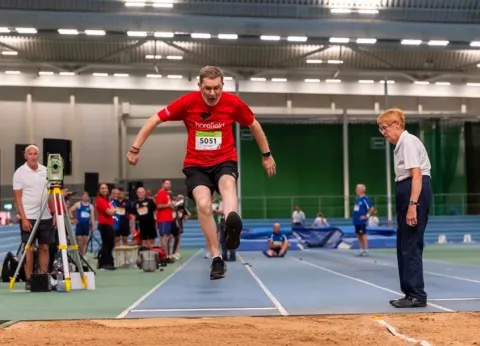 Dave competing in long jump at the British Transplant Games