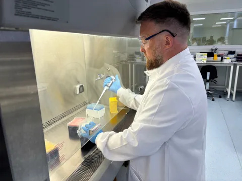 A scientist working in the advanced therapies manufacturing unit 