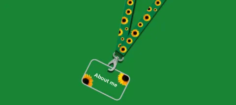 A sunflower lanyard and 'About me' card on a green background