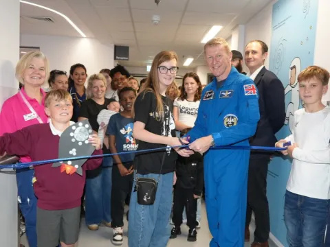 Astronaut Tim Peake cutting the ribbon to officially open Galaxy outpatients, Children's Day Treatment Centre.