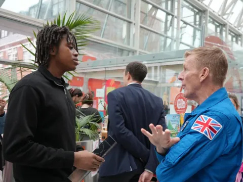 Tim and Dylan are speaking in the hospital atrium 