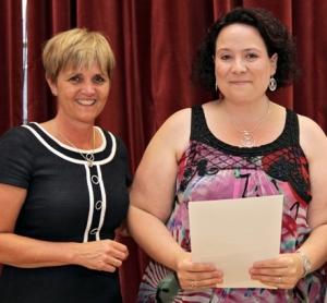 Emma Sayers (right), receiving her award from Eileen Sills, Chief Nurse (left)