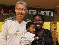 Torch bearer, Kevin Craig (left) and Evelina patient with mother