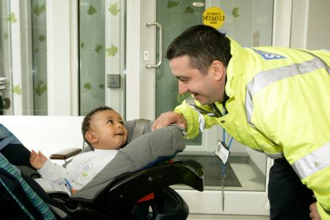 Guy's and St Thomas' security staff with a young child