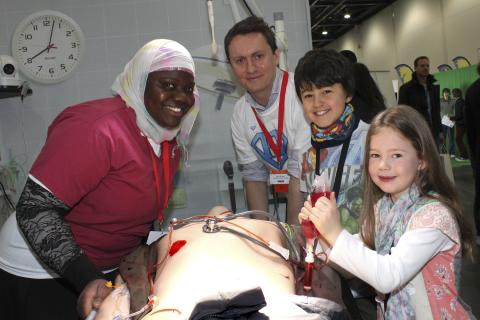 Children learning how to give life support