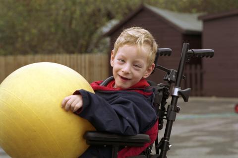 boy in wheelchair with ball