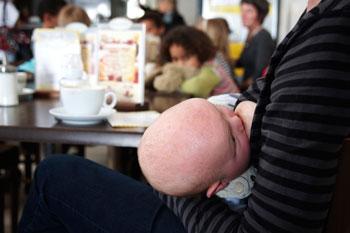 A mother breastfeeding her child