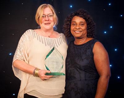 Cathy Ingram, head of service for the adult community directorate receives the Inspiring Leadership Award from Baroness Lawrence.