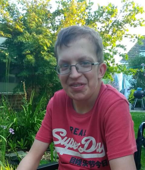 Patient Alex Masterson sitting in garden