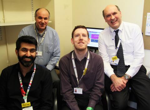 Liam Giles with Vikash Jogia, Alex Vella and Bill Dann from the Cancer Information Solution team