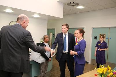 Steve Brine MP shakes hands with worker during visit to rare diseases centre
