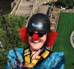 Alison Cooper wearing clown nose during St Thomas' abseil